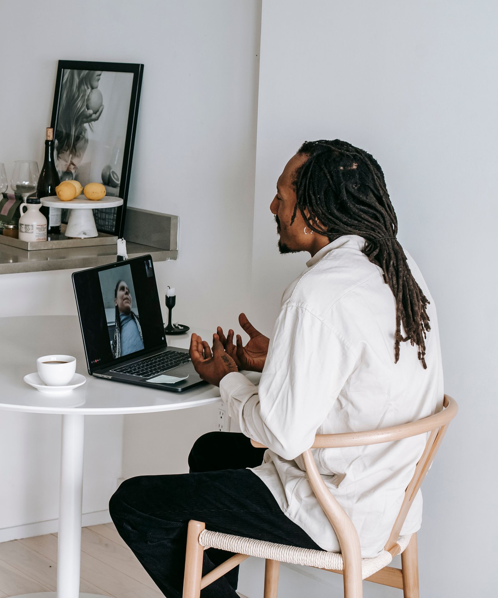 A person on a video call from a warm home setting